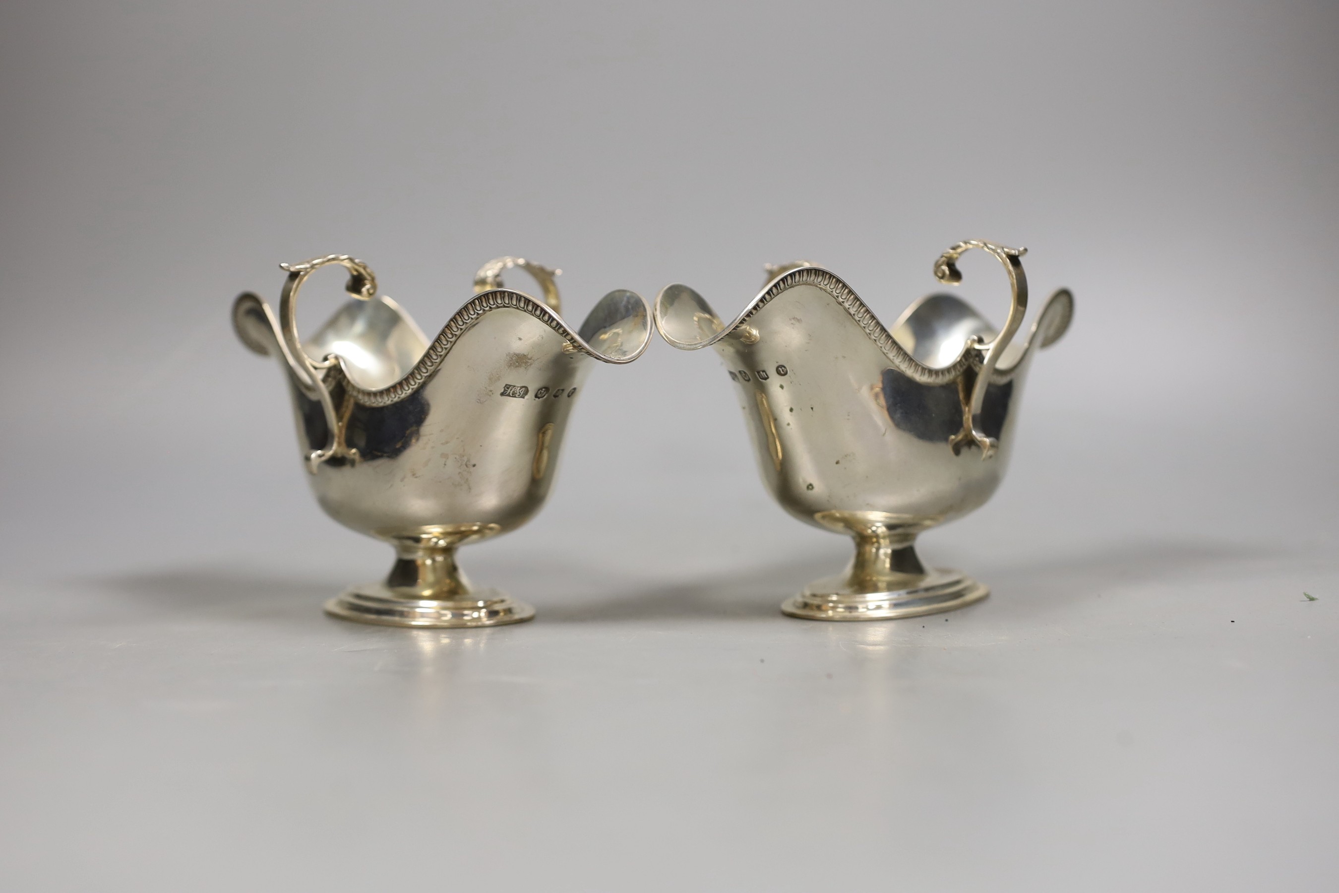 A pair of late Victorian Scottish silver double lipped sauceboats, Hamilton & Inches, Edinburgh, 1898, 11oz.